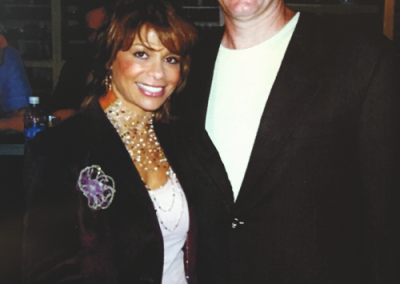 Mark posing at an event with Paula Abdul